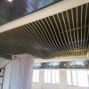 连锁餐厅幕墙吊顶装饰一体造型铝单板_木纹波浪造型铝单板