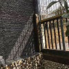 黑色流水石供应 别墅外墙天然文化流水石 青石花园墙叠水石
